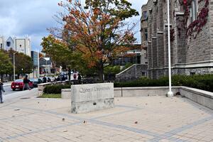 Queen's sign in front of the JDUC.