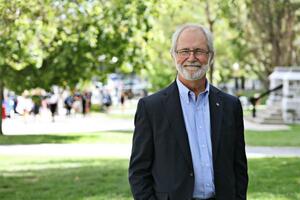 Outdoor headshot of Principal Patrick Deane