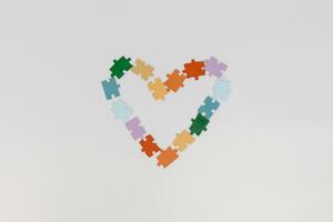 A heart made out of colourful puzzle pieces