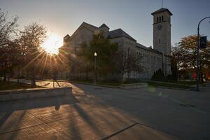 Grant Hall with sun setting behing it