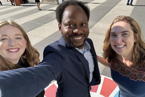 student and two researchers posing for selfie in NY
