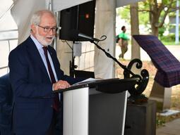 Principal Deane speaking at the podium