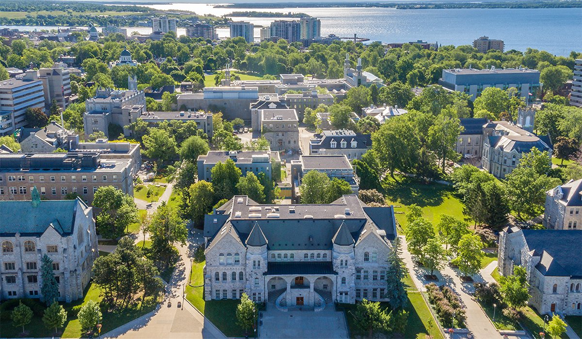 Aerial view of Queen's University campus, with focus on limestone buildings.