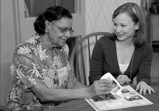 Cassandra Brown, Research Assistant (right), with Merle Domingo at the Alzheimer Society offices in the Rideaucrest Home. (Picture courtesy of the Kingston Whig-Standard, 21 March 2009)