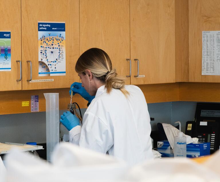 Graduate Student Working In Wet Lab