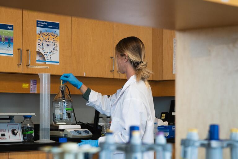 Graduate Student Working In Wet Lab
