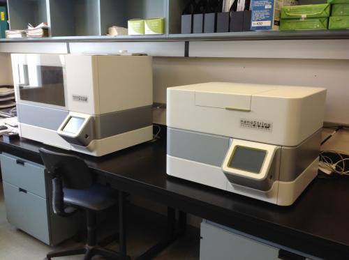 Photo of two NanoString machines on a lab bench at Rauh Lab
