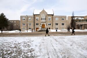 Richardson Hall in winter with snow on sidewalk