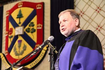 Alan Broadbent, the first student rector at Queen's University, speaks during spring convocation after receiving an honorary degree on June 8,2015..