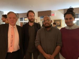 Four people posing for a photo