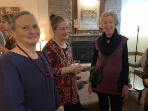 Three people smiling