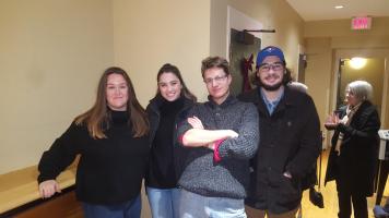 Four people posing for a photo