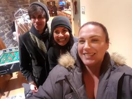 Three people smiling