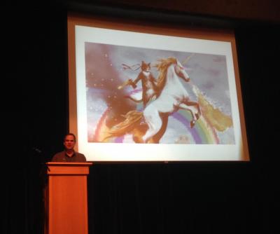 A piece of art with a cat, a unicorn and a rainbow