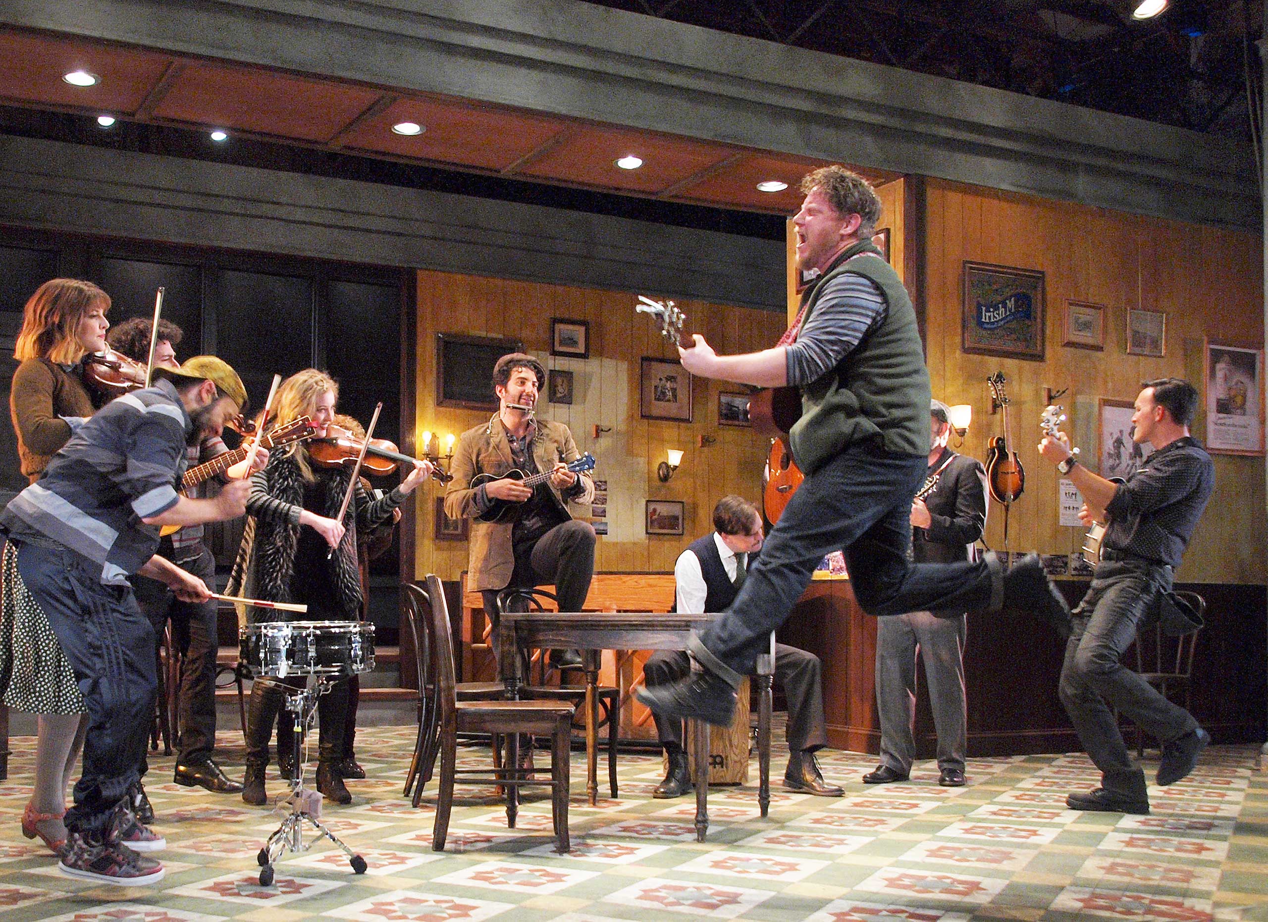 Actors rehearse for a musical on stage