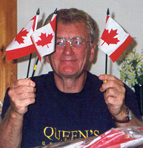[Malcolm Peat with Canada flags]