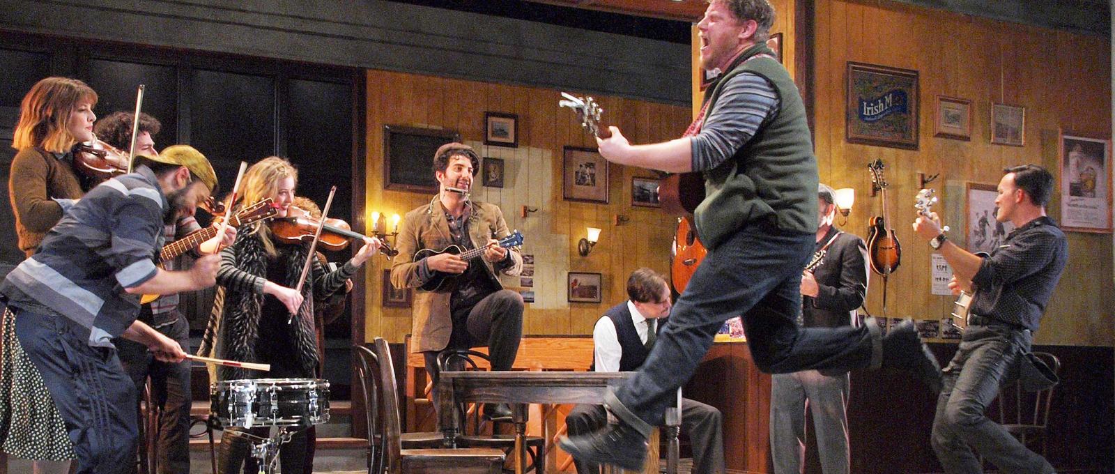 Actors rehearse for a musical on stage