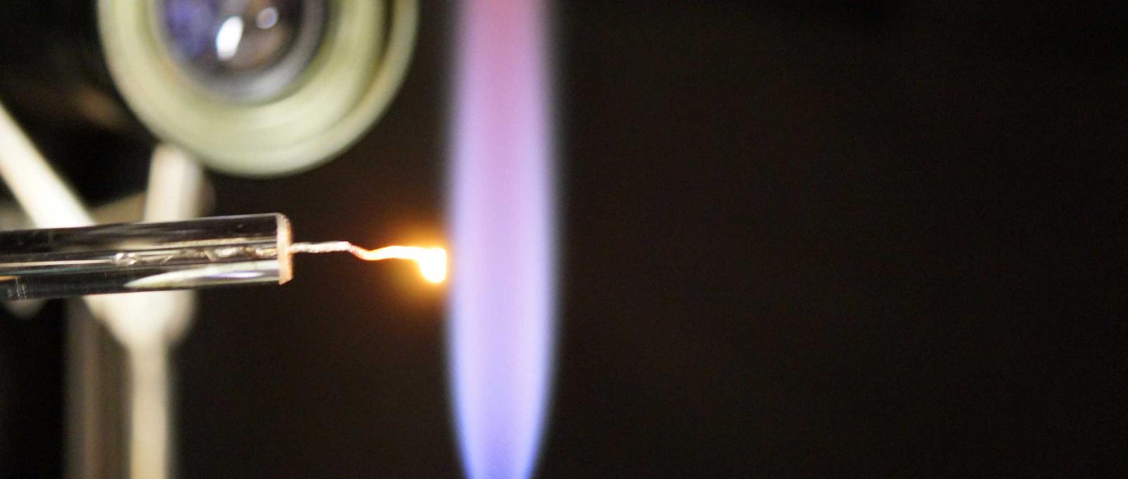 A platinum single crystal being annealed using a hydrogen flame