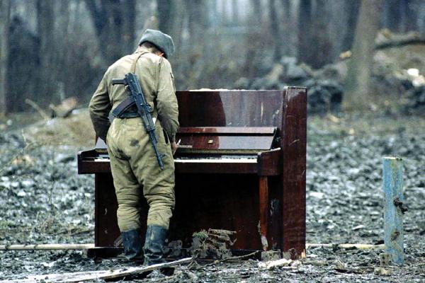 [soldier at a piano]