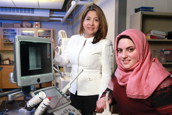 [Dr. Parvin Mousavi and Layan Nahlawi in lab]