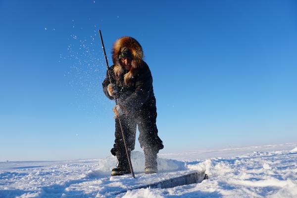 [Photo of George Konana collecting ice photographer by Saskia de Wildt]