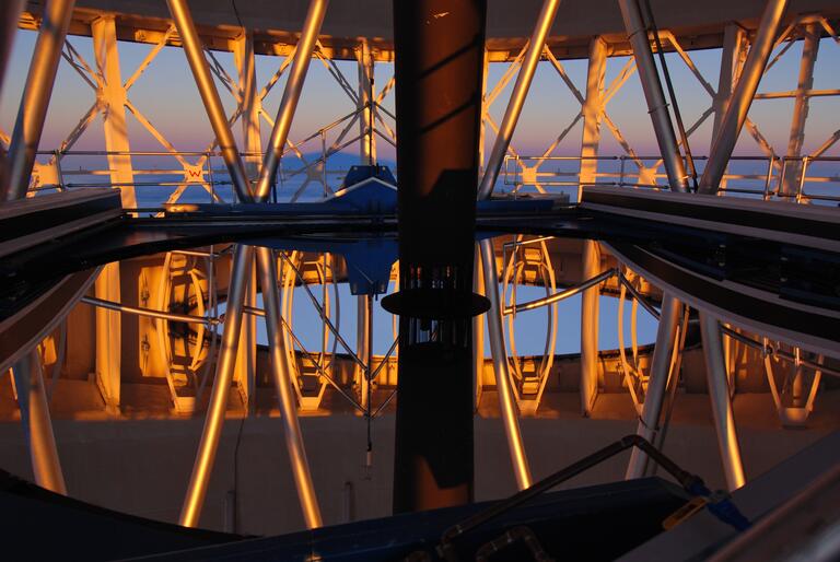 the sun reflecting off of mirrors inside of a telescope