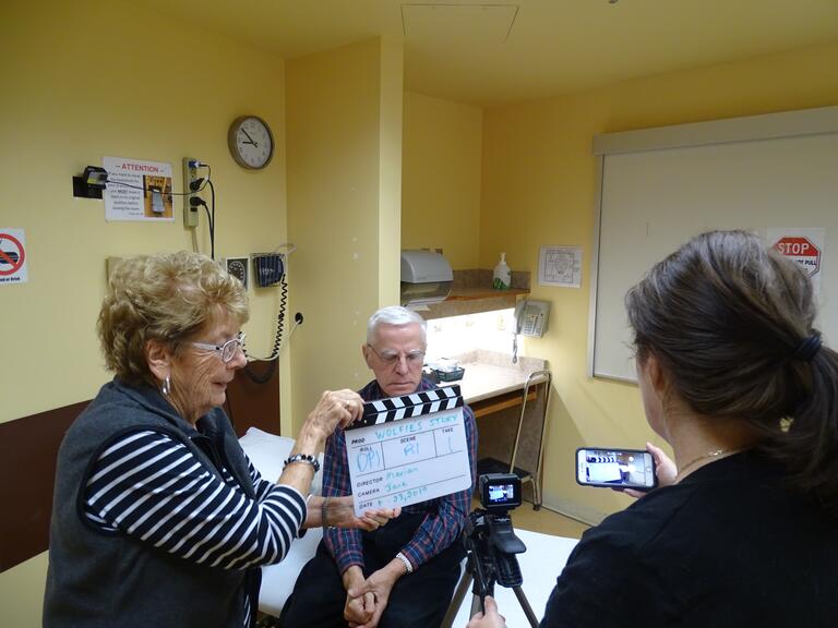 Three people filming in a doctors office