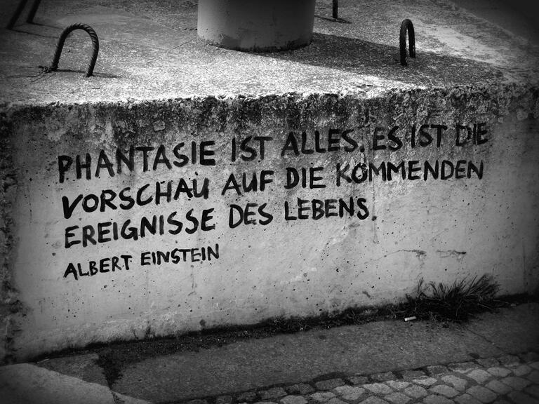 Black and White photo of German graffiti on concrete  