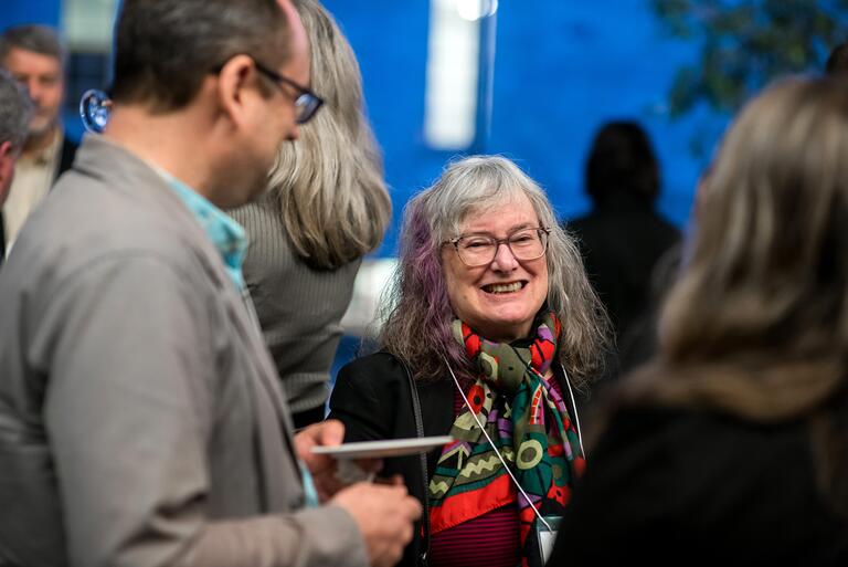 People in a crowd talking