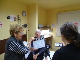 Three people filming in a doctors office