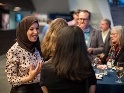 People in a crowd talking