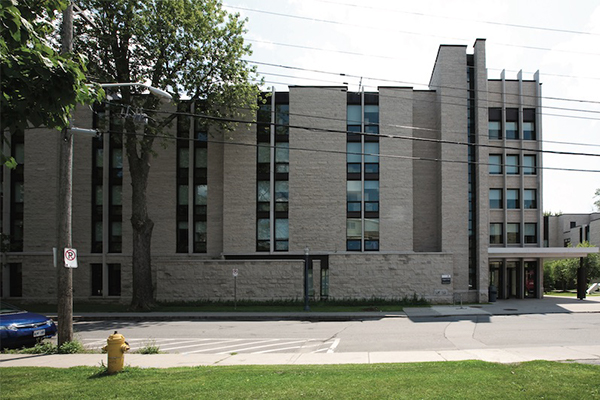 View of exterior of Leggett Hall during the day. 