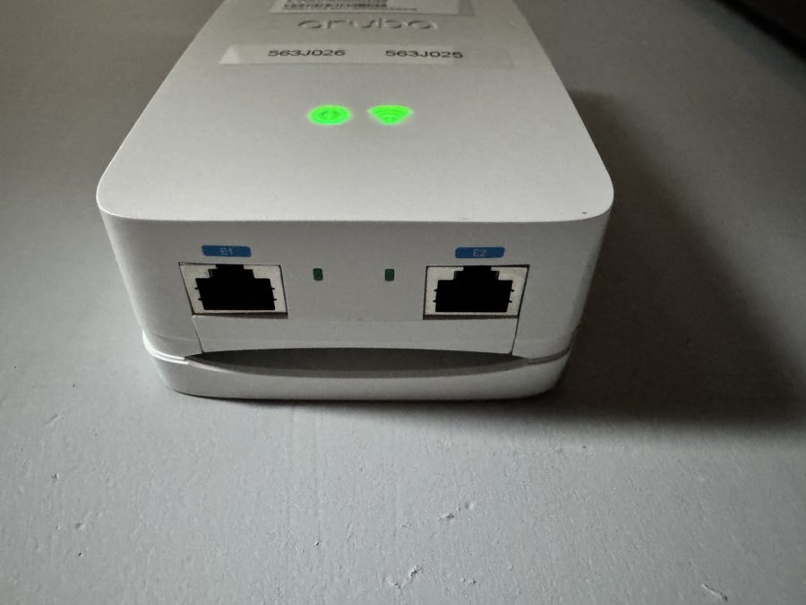 Underside of the same Aruba access point showing ports E1 and E2