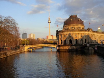 Buildings and bridges by a river.