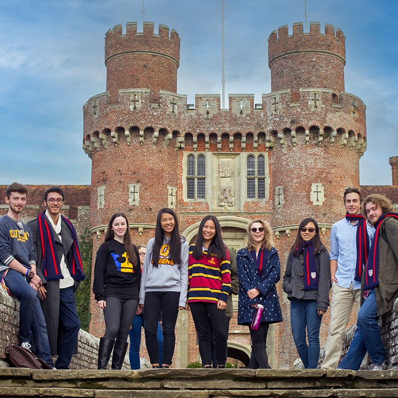 Queen's students standing in front of Herstmonceux Castle at Bader College.