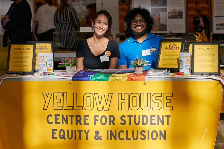 [Staff from the Yellow House meet students at a welcome fair]