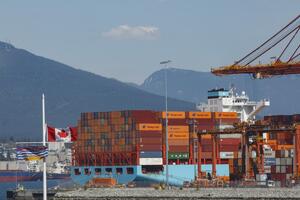 Shipyard with cargo ships and the Canadian flag
