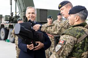 Mark Carney with Canadian soldiers