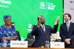 Cameroon Trade Minister Luc Magloire Mbarga Atangana (centre) closes the conference in the early hours of March 30, 2026. Left: WTO Director-General Ngozi Okonjo-Iweala. Right: Santiago Wills, director of the Secretariat’s Council Division