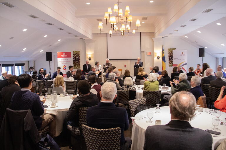 Members of the audience listen to panelists at the Celebrating Tom Courchene symposium