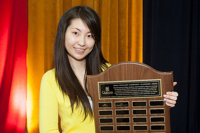 Tian Lu, a 2014 recipient of the Brian Yealland Community Leadership Award holds her plaque. 