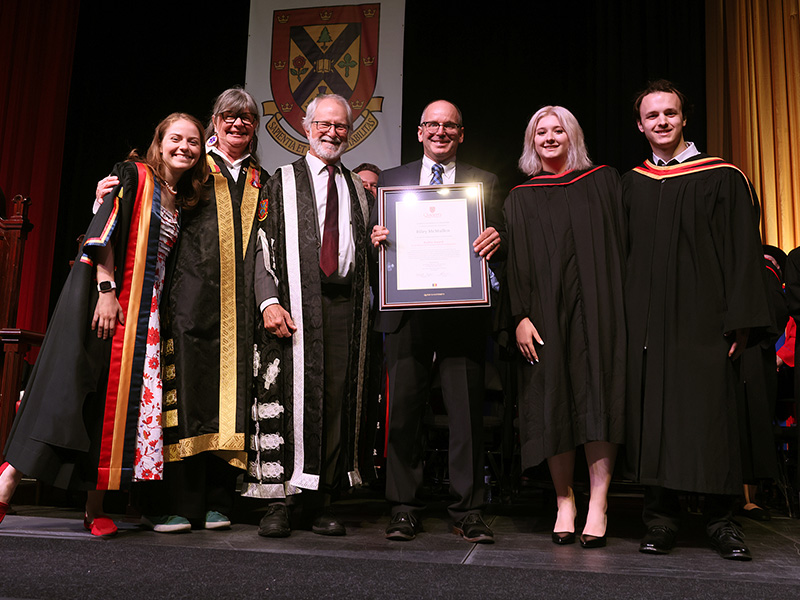 Riley McMullen receiving Baillie Award