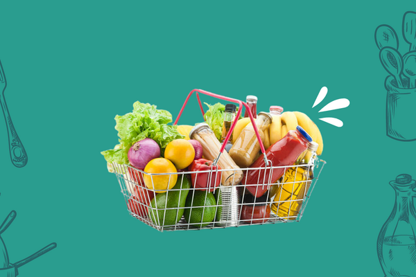 wire grocery basket filled with different fruits and vegetables