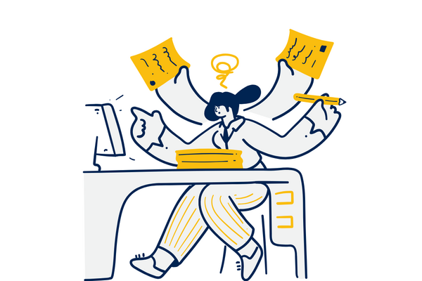 person at desk overwhelmed by work