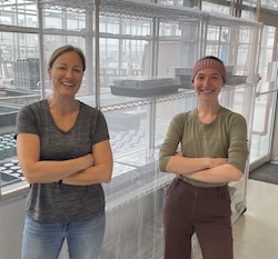 Amelia and Dr Barb Vanderbeld with the shelves