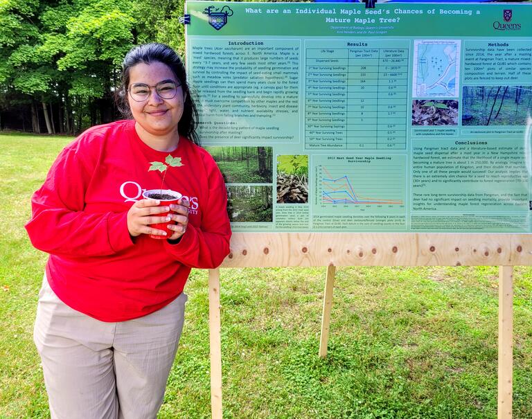 Kira Henders and her poster on maple seedling survivorship