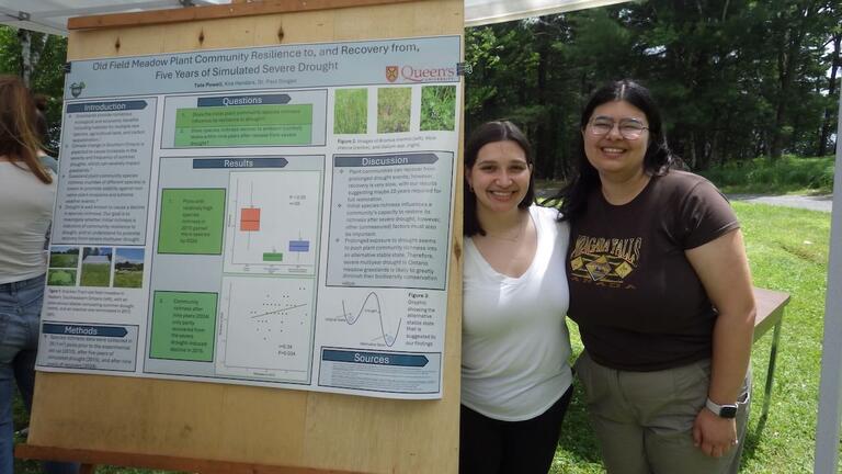 Tate and Kira at their poster during QUBS open day June 2024