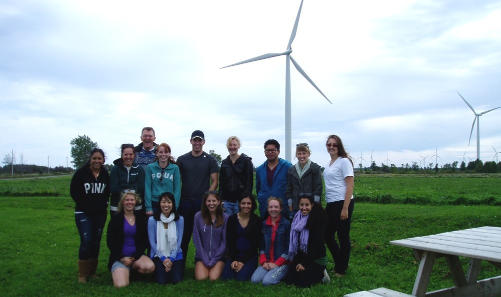 Class photo in front of a windmill
