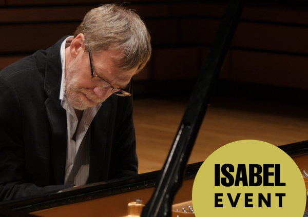 John Burge plays piano with a look of absolute concentration