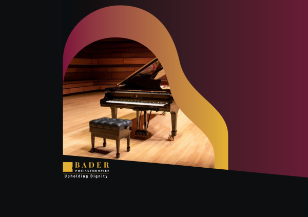 A piano sits on stage, ready to be played